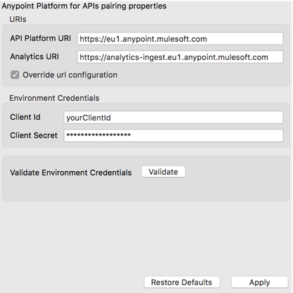 A form for entering Anypoint Platform API pairing properties with fields for API platform, analytics URIs, and client credentials